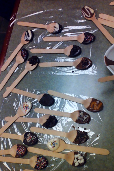 chocolate spoons drying on plastic