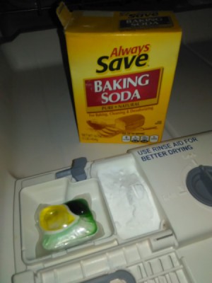 Use Baking Soda in the Dishwasher - dishwasher dispenser and box of baking soda