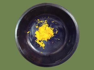 Uses For Orange Zest - small dark bowl with orange zest in bottom