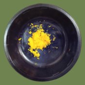 Uses For Orange Zest - small dark bowl with orange zest in bottom