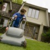 12 year old mowing a lawn.