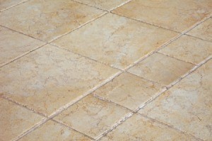 A tan colored ceramic tile floor.