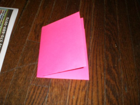 Valentine's Day Banner - fold in half again so that you can cut out 4 hearts at one time