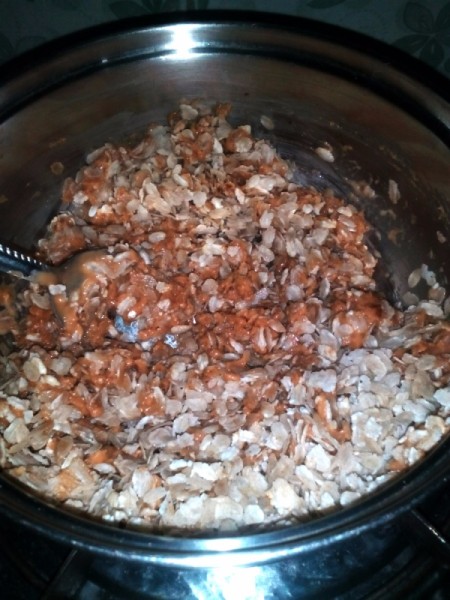 adding puffed rice to peanut butter mix