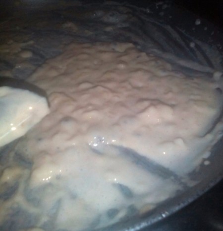 mixing cheese into milk