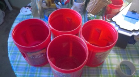 Using Coffee Tubs for Fabric Storage -  empty red plastic coffee cans