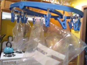 A baggie dryer with clips to hold sandwich bags.