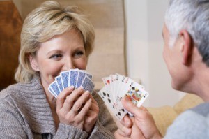 A couple playing a game with cards.