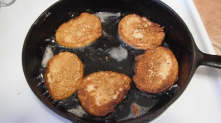 turned over fried cornbread in skillet