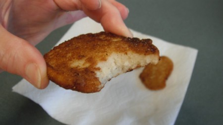 Cornbread patty with bite missing
