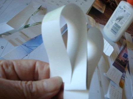 Upcycled Calendar Valentine's Heart Wreath - fold will be center of heart, make two loops to shape