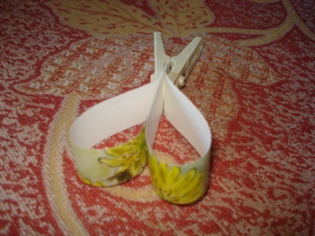 Upcycled Calendar Valentine's Heart Wreath - clothespin holding heart while it dries