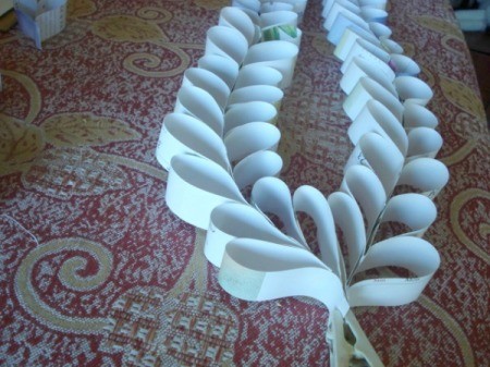 Upcycled Calendar Valentine's Heart Wreath - glue the bottom of the two chains together heart to heart