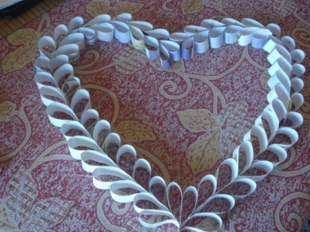 Upcycled Calendar Valentine's Heart Wreath - shape into a heart and glue the top together