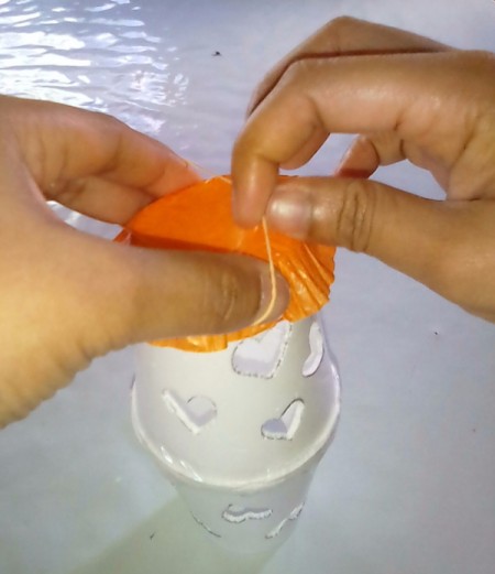 Heart Shapes Flashlight Cover - adding orange cupcake paper to top of cup and securing with rubber band