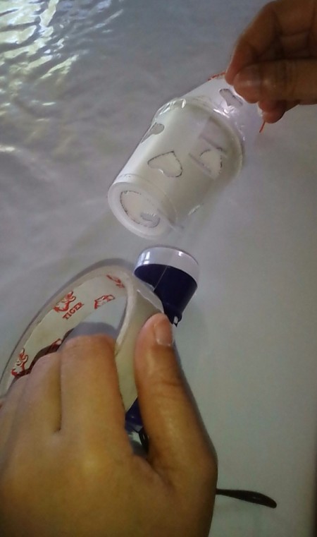 Heart Shapes Flashlight Cover - preparing to tape the flashlight to the cup with the hole cut in bottom