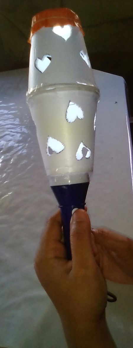 Heart Shapes Flashlight Cover - hand holding flashlight