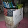 Decorate Food Cans For Office/ or Craft Storage - can decorated with scrapbook paper and wide ribbon holding pencils and a note half on with a clip
