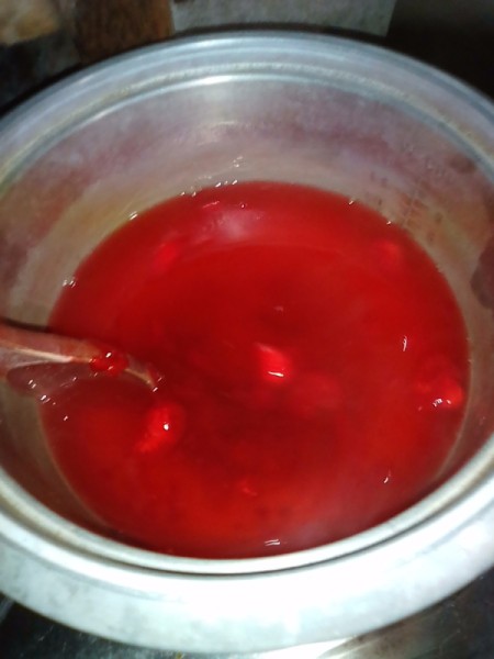 stirring gelatin packet in pot