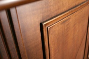 The corner of a wood cabinet door.