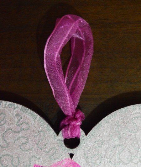 Hibiscus Love Mural Decoration - thread ribbon through the top hole and tie, add a drop of glue to knot