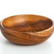 A wooden bowl on a white background.
