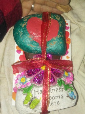 A Valentine's day gift with a painted rock and other treats.