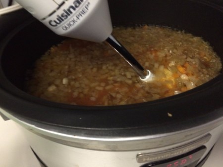 Blending soup with immersion blender