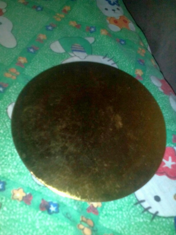 A gold colored cake plate.