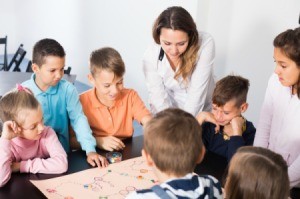 A group of children playing a board game.