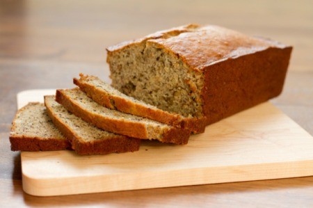 A loaf of banana bread, with thin slices.