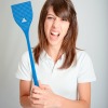 A woman holding a blue fly swatter.