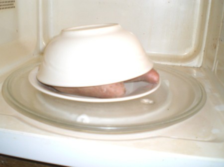 bowl covering sweet potatoes in a bowl