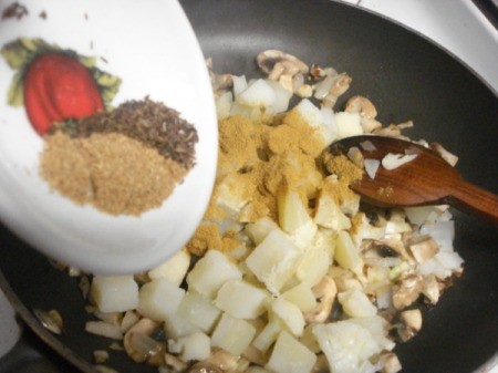 Adding spices to pan