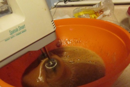 mixing wet ingredients with electric mixer