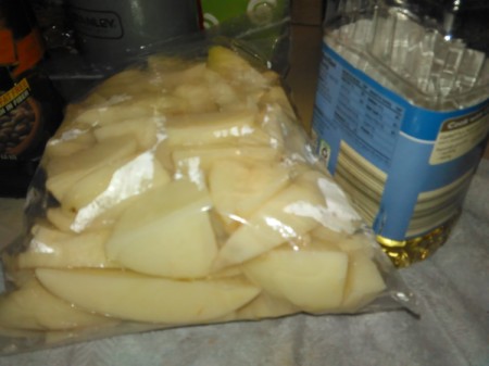 potato pieces in plastic bag with oil