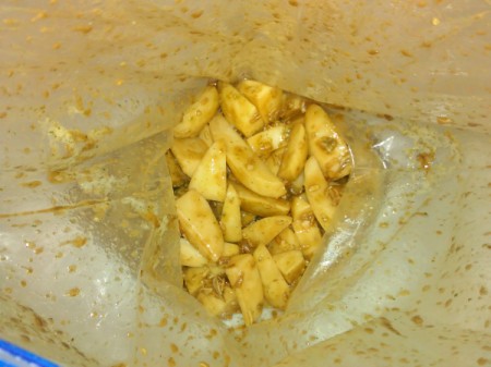 soup mix added to potatoes pieces in plastic bag