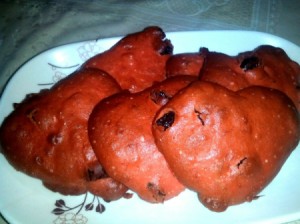 heart shaped, red cookies on plate