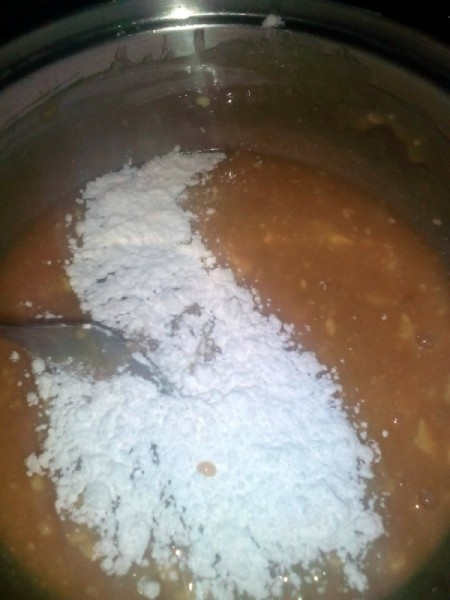 Adding flour to banana mix