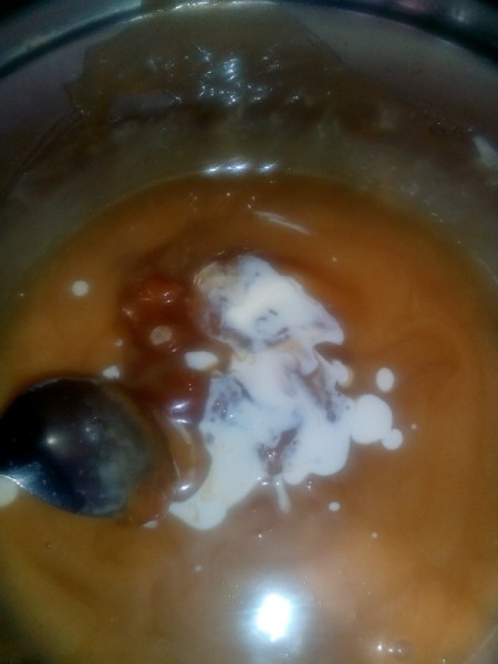 adding cream to caramel