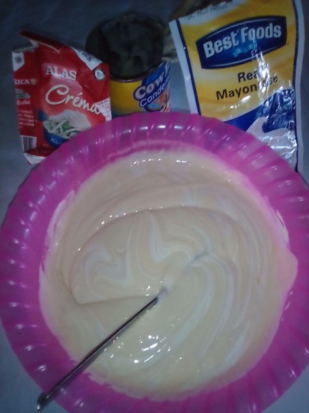 mixing mayonnaise, cream and milk