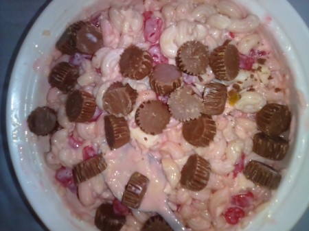 Adding chocolate to fruit and creamy macaroni