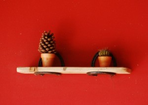 Shelf with metal supports.