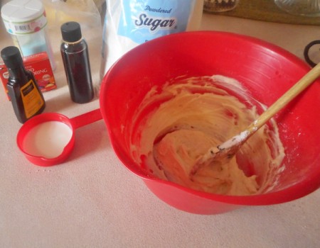adding frosting ingredients
