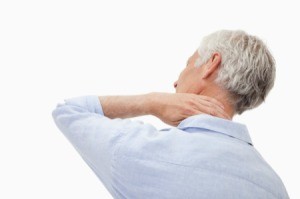A man holding his achy neck.