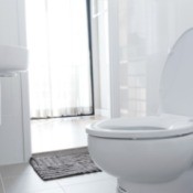 A clean white toilet in a home.