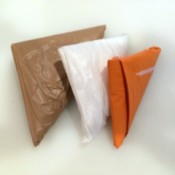 Three plastic bags folded using a football fold.