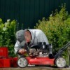 A man repairing a lawn mower.