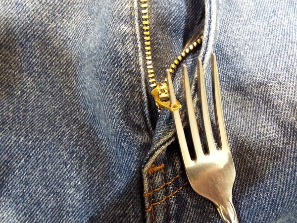 Using a fork tine to catch the zipper pull.