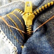 Sewing a stop into the zipper fly of jeans.